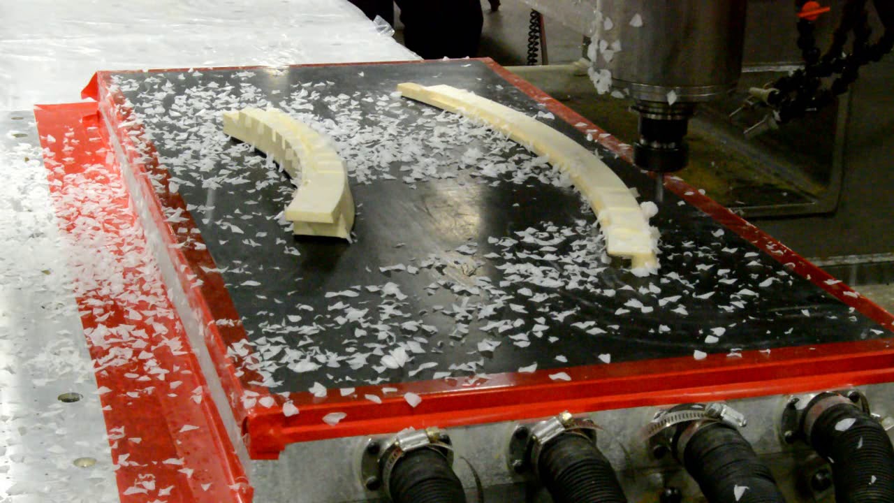 Vacuum Table Holds Down Custom Moldings for Secondary Processing
