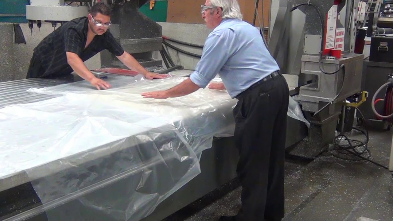 Vacuum Holddown of Plastic Material Used in Manufacturing of Athletic Shoes