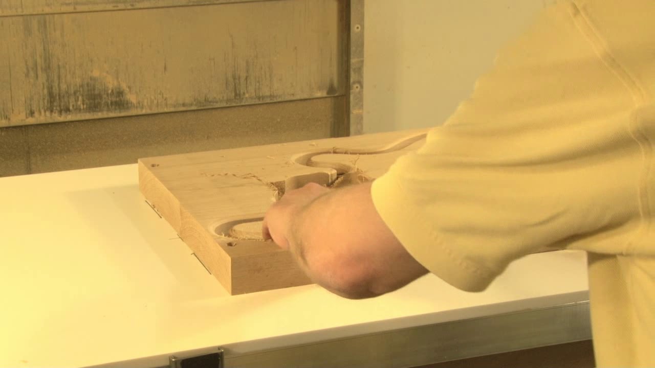 Vacuum Table Used in Complex Routing of Solid Wood Bass Guitar Body